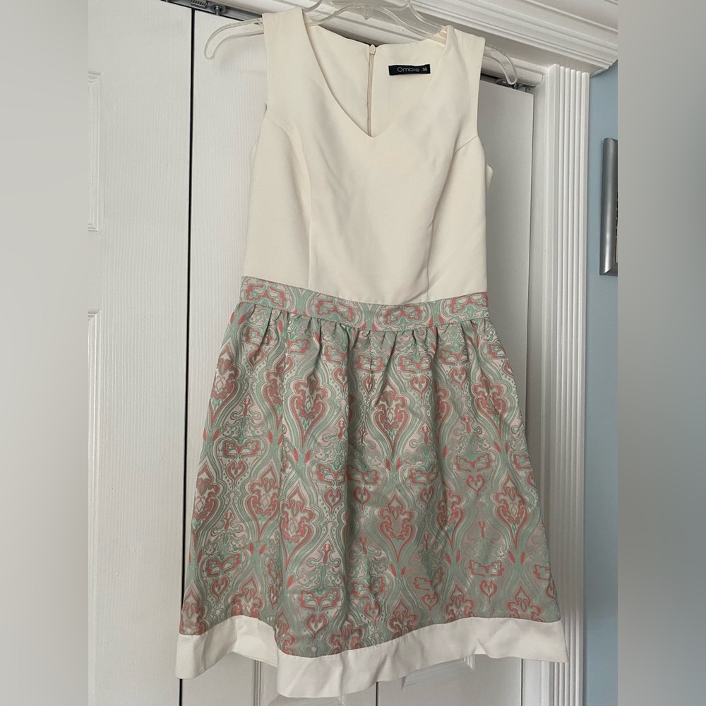 White dress, pasley print bottom